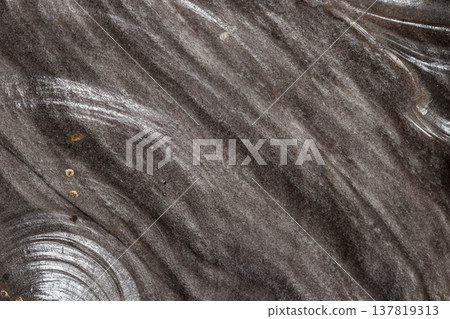 Macro stone mineral obsidian on a black background Macro stone mineral obsidian on a black background 137819313