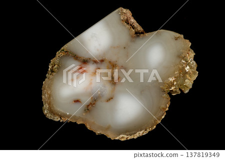 Macro stone Cacholong on parade on black background Macro stone Cacholong on parade on black background 137819349