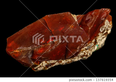 Macro stone Opal mineral in rock on a black background Macro stone Opal mineral in rock on a black background 137819354