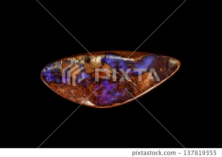 Macro stone Opal mineral in rock on a black background Macro stone Opal mineral in rock on a black background 137819355