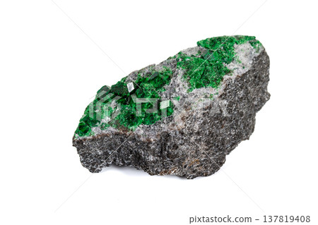 Macro stone garnet mineral, Uvarovite in rock on a white background Macro stone garnet mineral, Uvarovite in rock on a white background 137819408