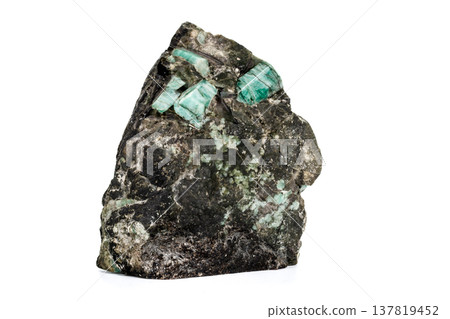 Macro emerald stone mineral in rock on white background 137819452