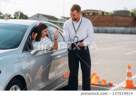 Woman is trying to pass exam in the driving school 137819914