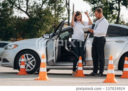Woman is trying to pass exam in the driving school 137819924