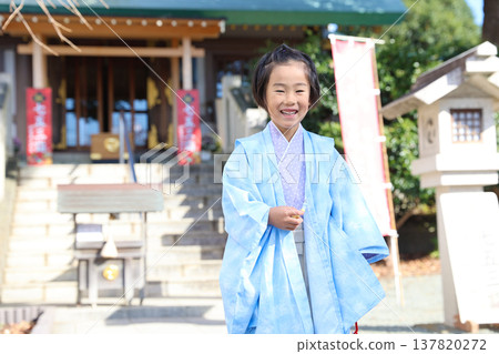 A boy wearing a pastel-colored kimono for Shichi-Go-San (a traditional Japanese rite of passage for children). A boy wearing a pastel-colored kimono for Shichi-Go-San (a traditional Japanese rite of passage for children). 137820272