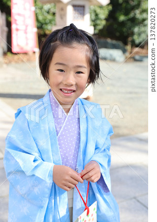 A boy wearing a pastel-colored kimono for Shichi-Go-San (a traditional Japanese rite of passage for children). A boy wearing a pastel-colored kimono for Shichi-Go-San (a traditional Japanese rite of passage for children). 137820273