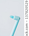 Macro view of single tuft toothbrush head, minimal dental cleaning concept on light background 137820529