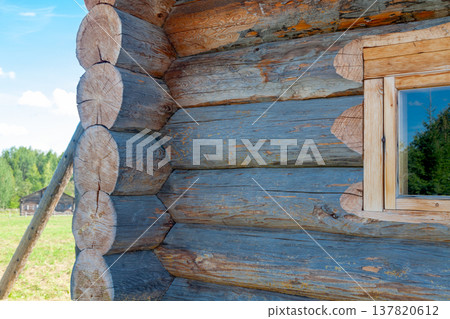 Corner of Wooden Log Cabin with Notched Joint, Close-Up Corner of Wooden Log Cabin with Notched Joint, Close-Up 137820612