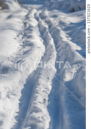 Sunlit snow ski tracks sparkling closeup, morning glare on crystals, shallow ruts, photographer composition study capturing texture and calm mindfuloutdoors mood Sunlit snow ski tracks sparkling closeup, morning glare on crystals, shallow ruts, photographer composition study capturing texture and calm mindfuloutdoors mood 137821629