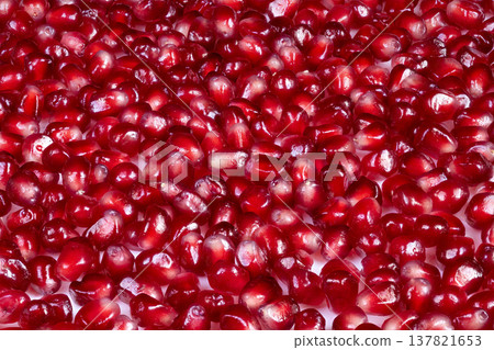 Colorful pomegranate seed pattern featuring glossy highlights and contrast. Striking pomegranate seed arrangement with vivid colors and reflective touches suitable for backgrounds Colorful pomegranate seed pattern featuring glossy highlights and contrast. Striking pomegranate seed arrangement with vivid colors and reflective touches suitable for backgrounds 137821653