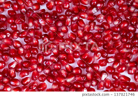 Vibrant ruby arils elevate sophisticated confections beautifully crafted. Shiny pomegranate seeds artfully scattered reveal refined culinary artistry and bright flavors Vibrant ruby arils elevate sophisticated confections beautifully crafted. Shiny pomegranate seeds artfully scattered reveal refined culinary artistry and bright flavors 137821746