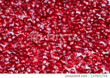 Macro pattern of ruby pomegranate arils, repeating jewellike reflections and saturated red tones, bold texture for backgrounds, textiles, seasonal branding and packaging Macro pattern of ruby pomegranate arils, repeating jewellike reflections and saturated red tones, bold texture for backgrounds, textiles, seasonal branding and packaging 137821758