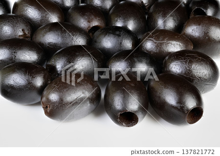 Repeating cluster of black olives. Abstract black olive motif for packaging and backgrounds. Minimalist and shiny black olives forming repeated pattern suitable for branding Repeating cluster of black olives. Abstract black olive motif for packaging and backgrounds. Minimalist and shiny black olives forming repeated pattern suitable for branding 137821772