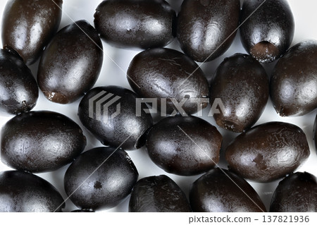 Showcasing polished olives with emphasized branding and clarity. Vivid photograph capturing shiny olives with clear packaging details and minimal background elements Showcasing polished olives with emphasized branding and clarity. Vivid photograph capturing shiny olives with clear packaging details and minimal background elements 137821936
