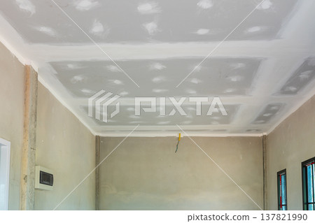 Ceiling installation process in home renovation residential space construction photography interior environment upward view diy concept Ceiling installation process in home renovation residential space construction photography interior environment upward view diy concept 137821990