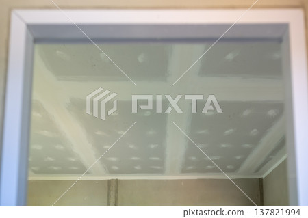 Ceiling construction progress residential interior photography drywall environment upward view home renovation concept 137821994