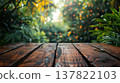 Wooden table in front of blurred garden background with bokeh light. 137822103