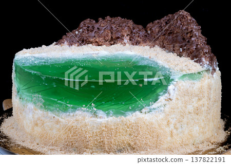 Baker preparing cake sample with visible jelly and crumb texture. Intimate kitchen scene showing baker preparing taste test of homemade cake with green jelly filling Baker preparing cake sample with visible jelly and crumb texture. Intimate kitchen scene showing baker preparing taste test of homemade cake with green jelly filling 137822191