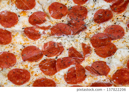 Delicious hot pizza. Crispy edged pizza topped with sizzling pepperoni slices. Steaming hot pepperoni pizza featuring charred crust and fragrant herbs ideal for promotion 137822206