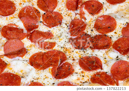 Delicious pizza appearance. Highdetail image showcasing flavorful pizza with shimmering oil. Closeup photograph capturing texture and brightness of seasoned pepperoni pizza Delicious pizza appearance. Highdetail image showcasing flavorful pizza with shimmering oil. Closeup photograph capturing texture and brightness of seasoned pepperoni pizza 137822213