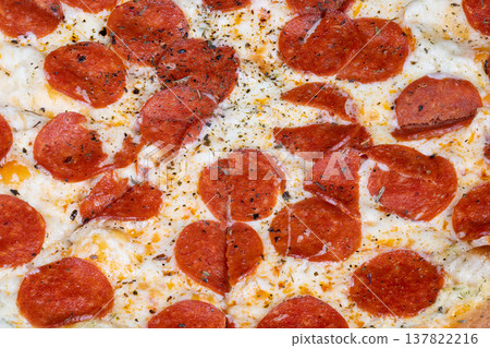 Melty cheese pepperoni pizza closeup ovenbaked, bubbling mozzarella, glistening oil pools, round pepperoni discs, scattered oregano and black pepper, warm indulgent mood Melty cheese pepperoni pizza closeup ovenbaked, bubbling mozzarella, glistening oil pools, round pepperoni discs, scattered oregano and black pepper, warm indulgent mood 137822216