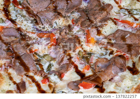 Savory pizza delight. Glistening teriyaki pizza featuring tender meat and smoky spices. Closeup of glazed teriyaki pizza highlighting charred cheese and spicy toppings Savory pizza delight. Glistening teriyaki pizza featuring tender meat and smoky spices. Closeup of glazed teriyaki pizza highlighting charred cheese and spicy toppings 137822257