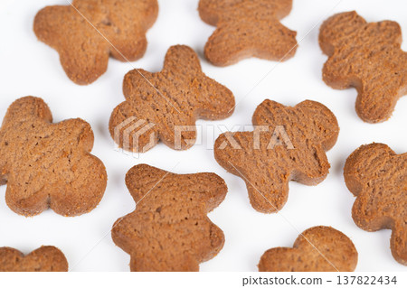 Closeup of cookies. Crispy baked cookies on bright background. Ecommerce suitable image showcasing loose arrangement of freshly baked clovershaped cookies with shallow focus Closeup of cookies. Crispy baked cookies on bright background. Ecommerce suitable image showcasing loose arrangement of freshly baked clovershaped cookies with shallow focus 137822434
