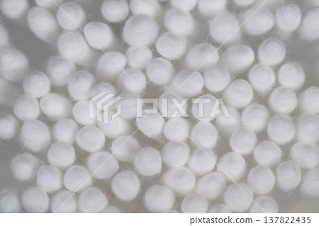 Close up cotton swabs heads arranged in sterile grid, soft fibrous tips illuminated by diffused light, clinical texture and macro detail for healthcare and hygiene visuals Close up cotton swabs heads arranged in sterile grid, soft fibrous tips illuminated by diffused light, clinical texture and macro detail for healthcare and hygiene visuals 137822435
