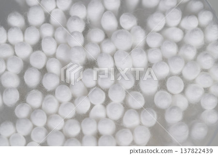 Uniform circular tips creating continuous textured background fabric. Abstract pattern featuring cotton swabs with consistent round tips for textiles or backgrounds Uniform circular tips creating continuous textured background fabric. Abstract pattern featuring cotton swabs with consistent round tips for textiles or backgrounds 137822439