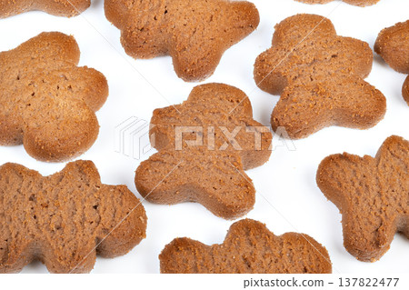 Decorative cookie variety. Colorful cookies featuring whimsical shapes and patterns. Assorted cookies with lively shapes and vivid colors spread across white surface 137822477