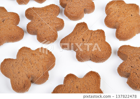 Snacks with grains. Natural light emphasizes texture of nutritious bread slices. Displaying wholesome cookies with textured grains on bright white background for meal options 137822478