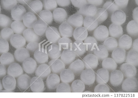 Detailed soft fiber macro. Macro view of smooth white cotton swabs with shadows. Abstract pattern of tightly clustered cotton tips emphasizing purity and simplicity 137822518