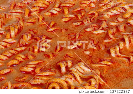 Vivid noodle imagery. Detailed shot highlighting rich noodle textures and spices. Commercial photograph showcasing vibrant noodles with real ingredients and glossy finish 137822587