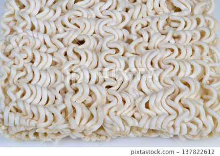 Dry instant noodles still life with minimalist styling, soft lighting and negative space, versatile for lifestyle editorials and social visuals about convenience food Dry instant noodles still life with minimalist styling, soft lighting and negative space, versatile for lifestyle editorials and social visuals about convenience food 137822612