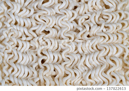 Dry instant noodles closeup used in sustainable ingredient study, focus on grain structure and starch, conceptual image for food science and reformulation research Dry instant noodles closeup used in sustainable ingredient study, focus on grain structure and starch, conceptual image for food science and reformulation research 137822613