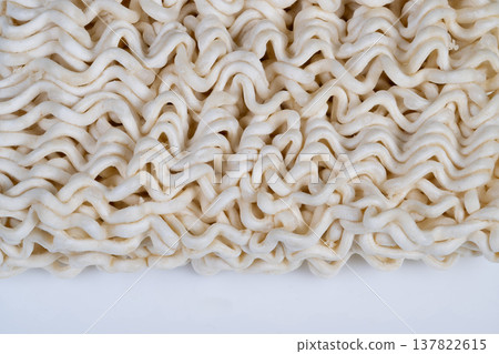 Abstract noodle pattern creation. Instant noodles evolved into decorative art forms. Rapidly prepared noodles morphed into complex abstract designs for visual and editorial use 137822615