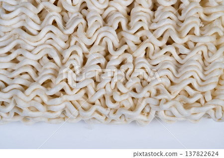 dry instant noodles background texture for design use, repeating wavy strands produce subtle rhythm, neutral tones suitable for web, print and product art dry instant noodles background texture for design use, repeating wavy strands produce subtle rhythm, neutral tones suitable for web, print and product art 137822624