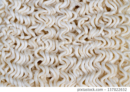 Flatlay dry instant noodles arranged for packaging mockup, clean backdrop, consistent noodle blocks, optimized negative space for label placement and branding visuals Flatlay dry instant noodles arranged for packaging mockup, clean backdrop, consistent noodle blocks, optimized negative space for label placement and branding visuals 137822632