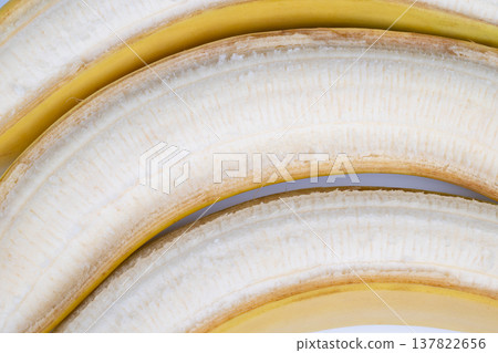 Ripe peeled bananas staged for pastry prep and baking inspiration, textured flesh and curved lines highlighted for recipe blogs, dessert menus, and ingredient photography Ripe peeled bananas staged for pastry prep and baking inspiration, textured flesh and curved lines highlighted for recipe blogs, dessert menus, and ingredient photography 137822656