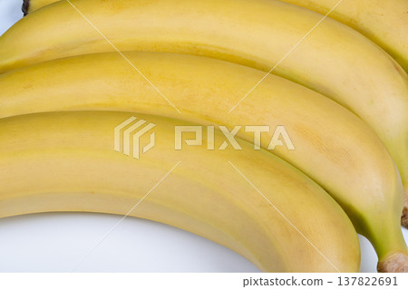 Bananas for blending. Bright yellow ripe bananas prepared for blending tasks. Yellow ripened bananas arranged for blending into smoothies with creamy texture suggested Bananas for blending. Bright yellow ripe bananas prepared for blending tasks. Yellow ripened bananas arranged for blending into smoothies with creamy texture suggested 137822691