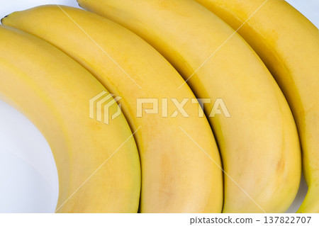 Lively and vivid bananas offer wholesome and delightful family snacks. Bright and vibrant bananas provide nourishing and enjoyable snacks for whole family to savor Lively and vivid bananas offer wholesome and delightful family snacks. Bright and vibrant bananas provide nourishing and enjoyable snacks for whole family to savor 137822707