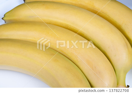 Banana smoothie ingredients. Use yellow bananas for delicious and creamy smoothies at home. Perfectly ripe bananas enhance texture and flavor of homemade smoothie beverages Banana smoothie ingredients. Use yellow bananas for delicious and creamy smoothies at home. Perfectly ripe bananas enhance texture and flavor of homemade smoothie beverages 137822708
