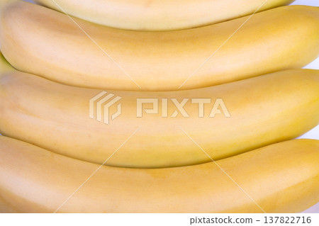 Vivid yellow banana design emphasizing recurring curves and textured peel. Bold yellow visual featuring array of curved bananas with detailed peel textures for background use Vivid yellow banana design emphasizing recurring curves and textured peel. Bold yellow visual featuring array of curved bananas with detailed peel textures for background use 137822716