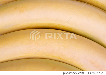 Fresh bananas inspire morning health. Sweet ripe bananas awaiting their turn in blender. Sunlit kitchen sets scene for healthy breakfast with ripe banana preparation Fresh bananas inspire morning health. Sweet ripe bananas awaiting their turn in blender. Sunlit kitchen sets scene for healthy breakfast with ripe banana preparation 137822734
