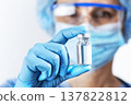 Healthcare Professional Holding a Vaccine Vial 137822812