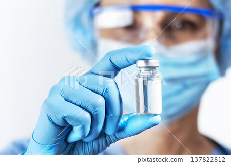 Healthcare Professional Holding a Vaccine Vial Healthcare Professional Holding a Vaccine Vial 137822812