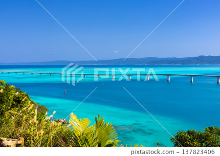View of Kouri Bridge and the Kouri Blue sea from Unten Mori Park Observatory in Unten, Nakijin Village, Kunigami District, Okinawa Prefecture 137823406