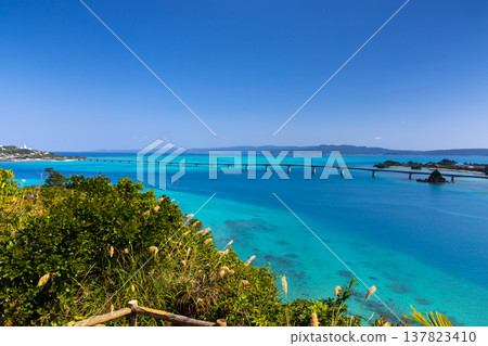 View of Kouri Bridge and the Kouri Blue sea from Unten Mori Park Observatory in Unten, Nakijin Village, Kunigami District, Okinawa Prefecture View of Kouri Bridge and the Kouri Blue sea from Unten Mori Park Observatory in Unten, Nakijin Village, Kunigami District, Okinawa Prefecture 137823410