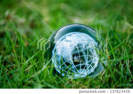 Renewable energy concept Earth Day or environment protection Hands protect forests that grow on the ground and help save the world. Renewable energy concept Earth Day or environment protection Hands protect forests that grow on the ground and help save the world. 137823439