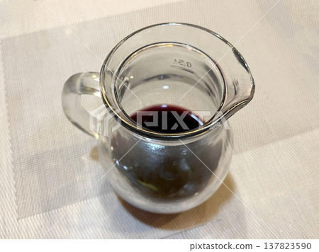 a wine jug isolated on the table 137823590